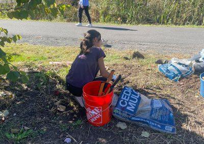 Saige clearing the Pollinator Pathway