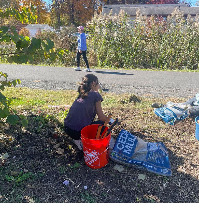 Saige clearing the Pollinator Pathway